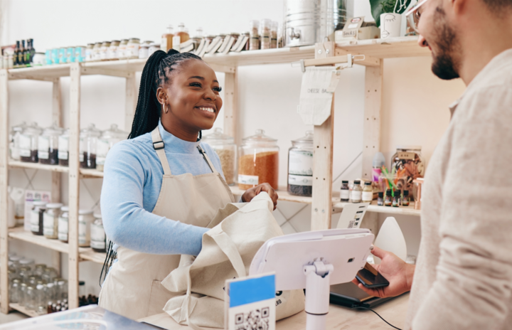 Sustainable shop, cashier and client with store purchase after considering merchant services vs. POS systems